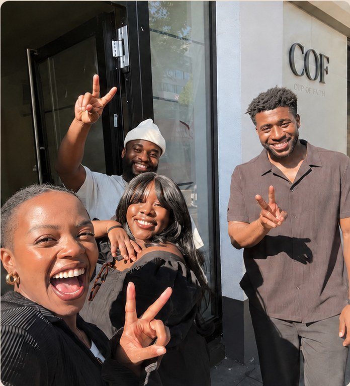 The four COF founders laughing outside the cafe